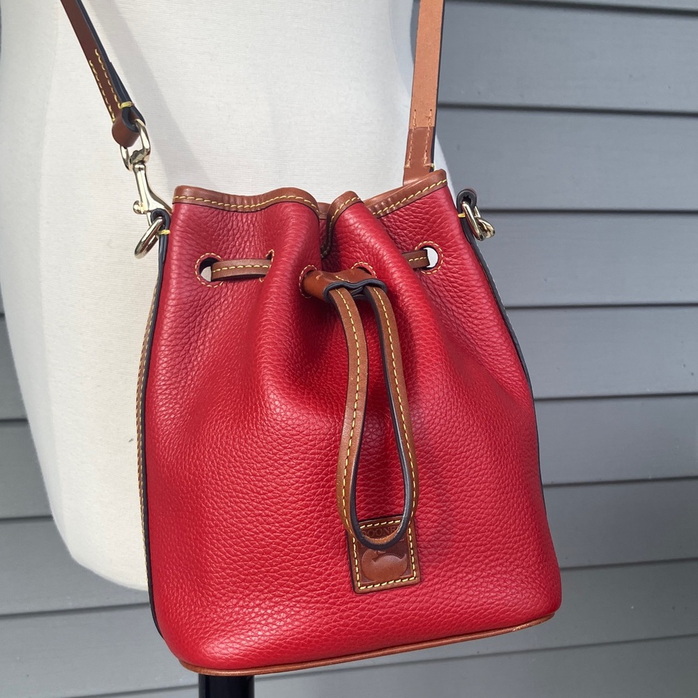 Dooney & Bourke red pebble grain leather small drawstring crossbody purse.